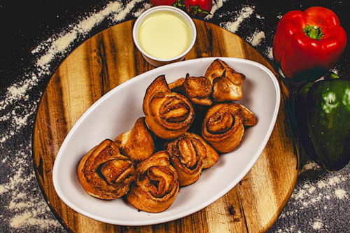 Produktbild Gefüllte Pizzabrötchen Zimtschnecken inkl. Vanillesauce 80ml